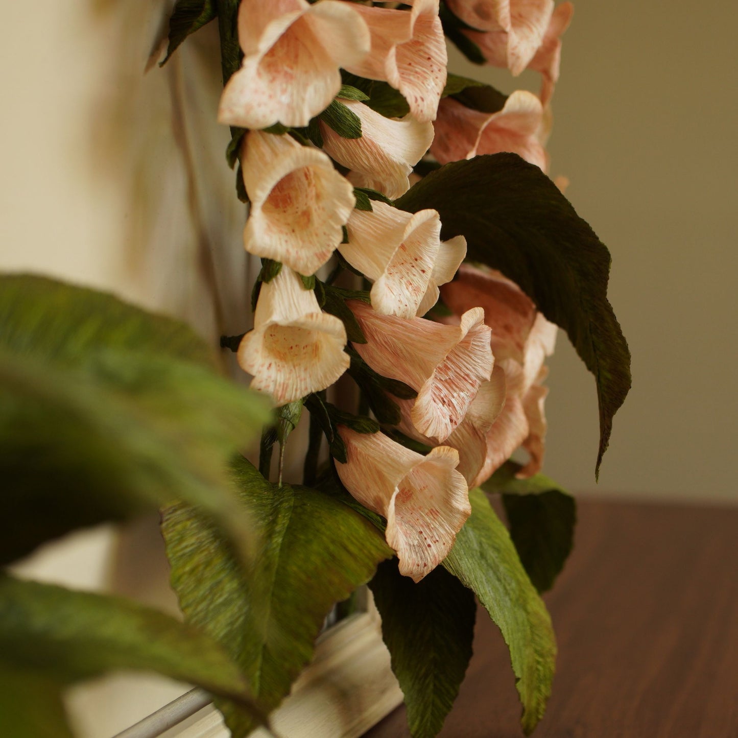 Detail of foxglove stem and leaves in handcrafted paper botanical artwork