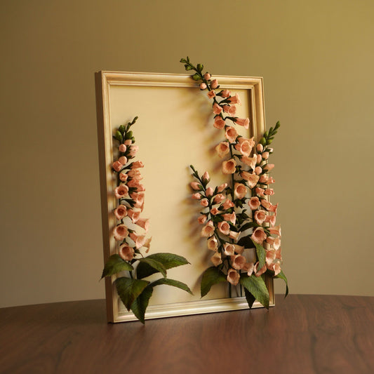 Angled view of framed paper foxglove flowers showing depth and sculptural layering