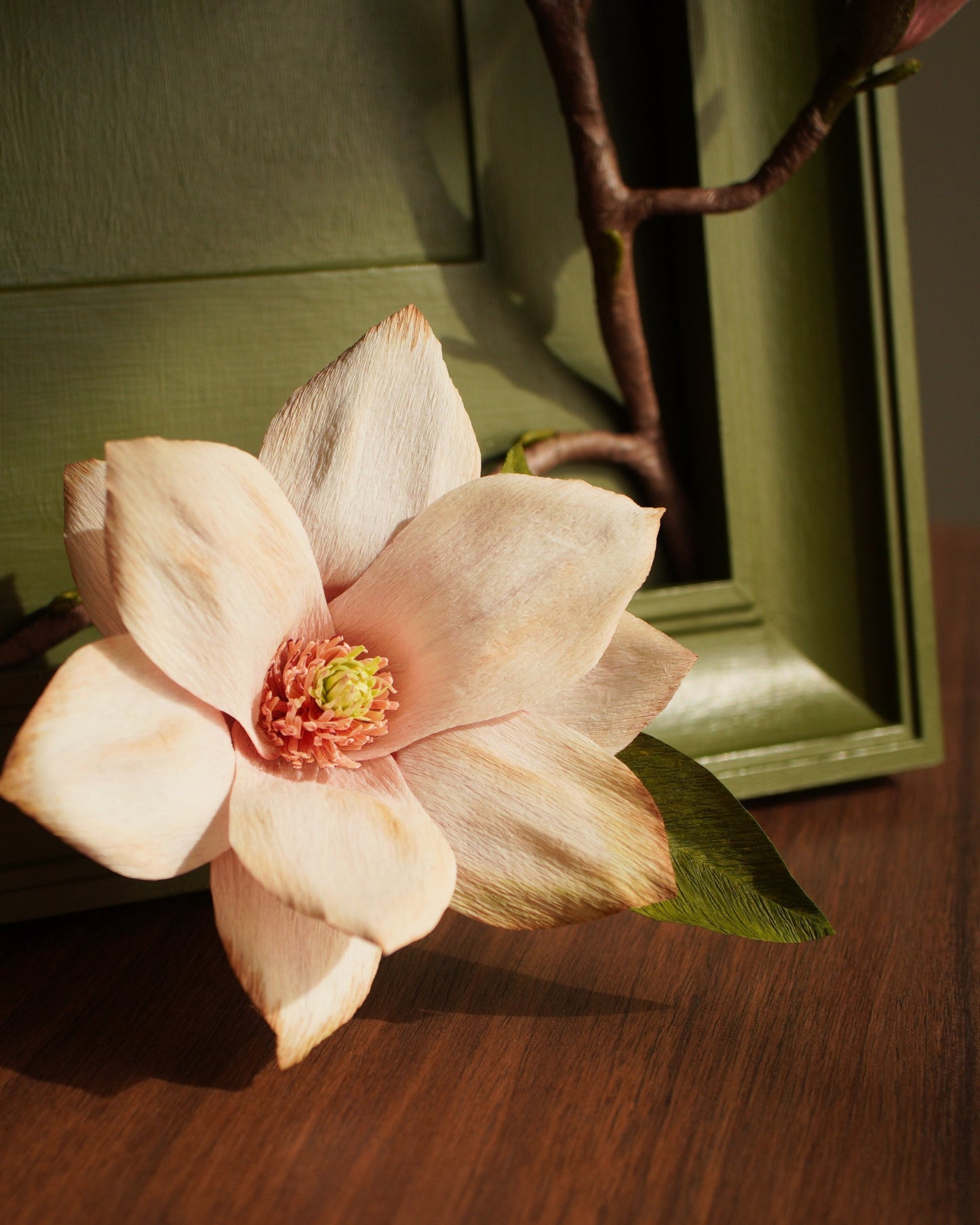 Close-up of open paper magnolia flower showing petal shape and centre detail