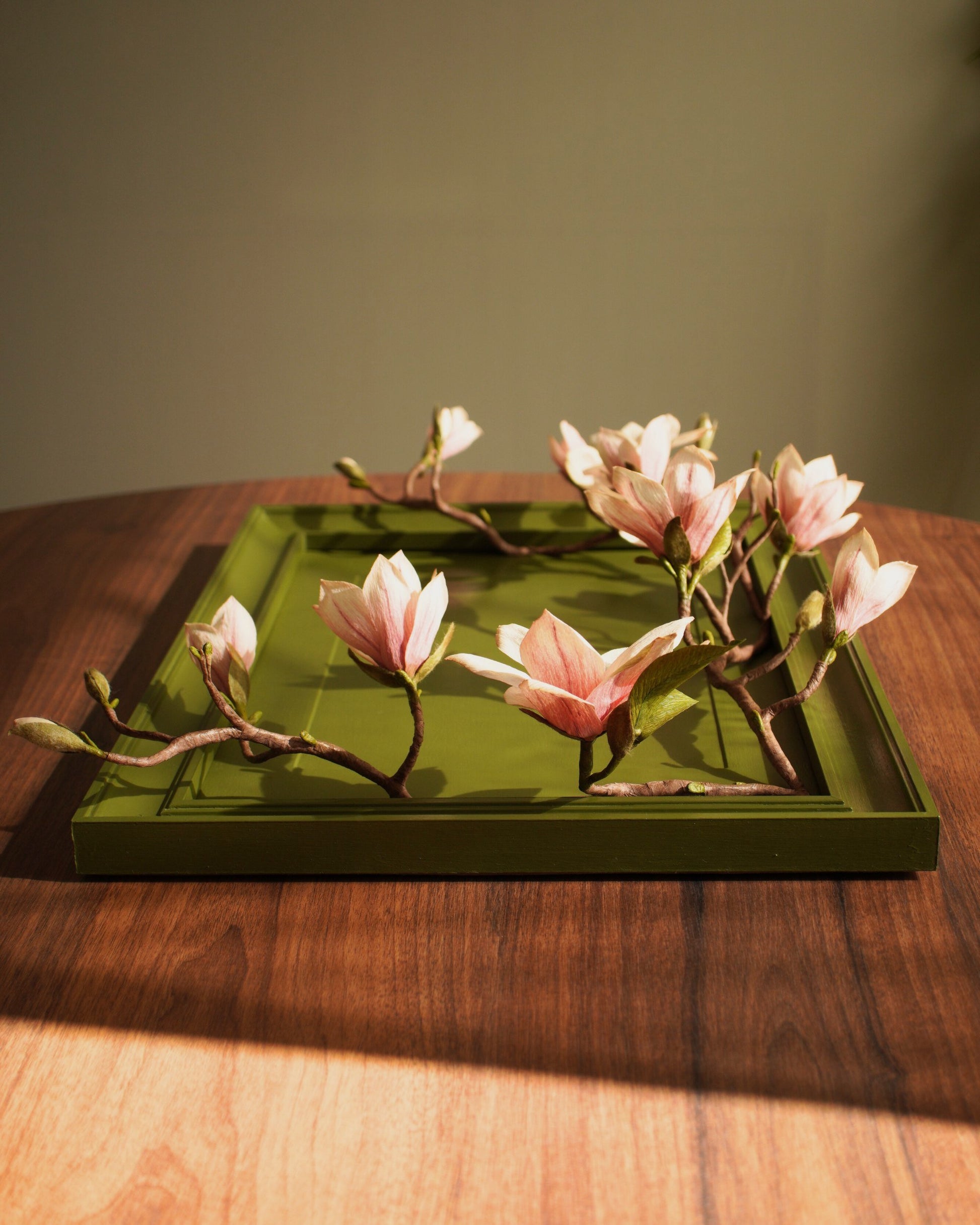 Framed magnolia piece laid flat showing full composition and branching structure